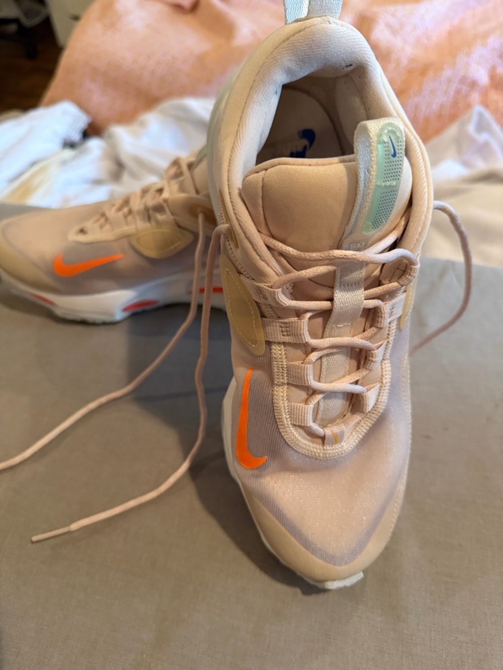Nike Women’s Light Pink Sneakers with Orange Swoosh